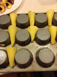 Half-Baked wafers rolled into cone shape and placed on an upside down muffin tin.